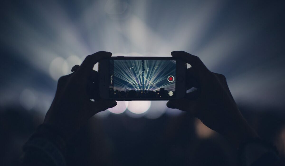 iphone, concert, lights, stage lights, record, video, recording, video recording, capture, apple product, hands, audience, event, live event, live performance, dark, party, smartphone, crowd, video, video, video, video, video